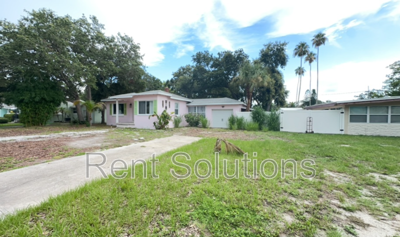 Charming Dunedin Retreat: 2BR Home with Sunroom & Garage! property image