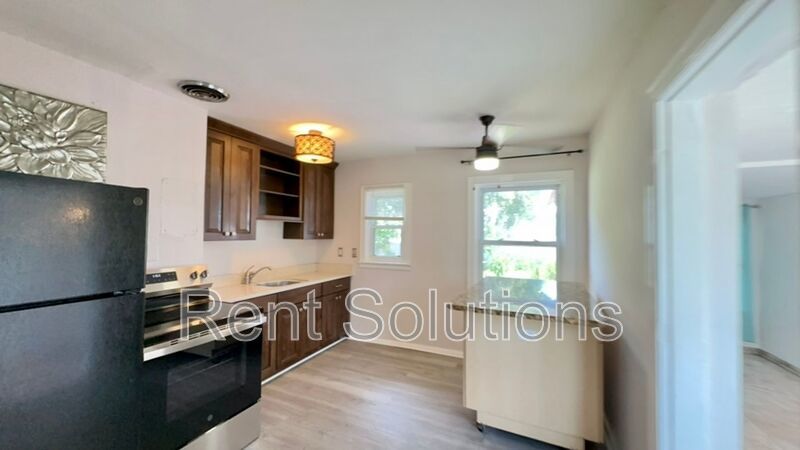 Charming Dunedin Retreat: 2BR Home with Sunroom & Garage! property image