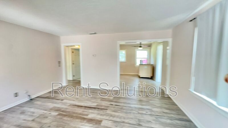 Charming Dunedin Retreat: 2BR Home with Sunroom & Garage! property image