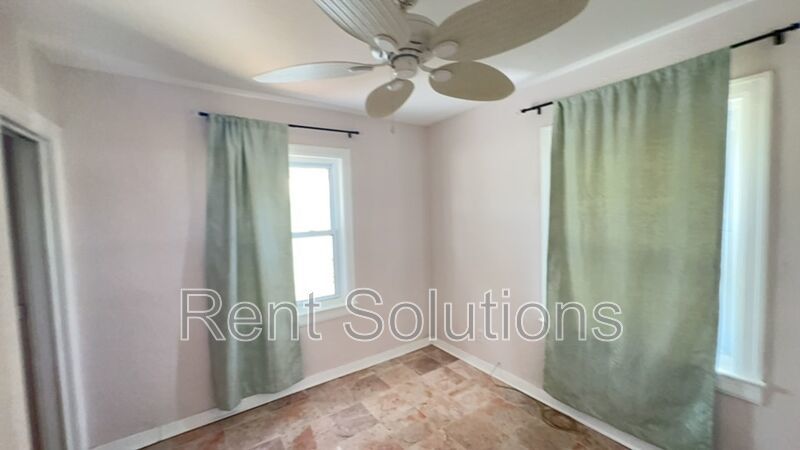 Charming Dunedin Retreat: 2BR Home with Sunroom & Garage! property image