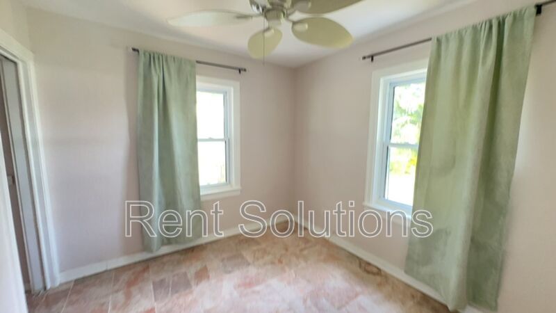 Charming Dunedin Retreat: 2BR Home with Sunroom & Garage! property image