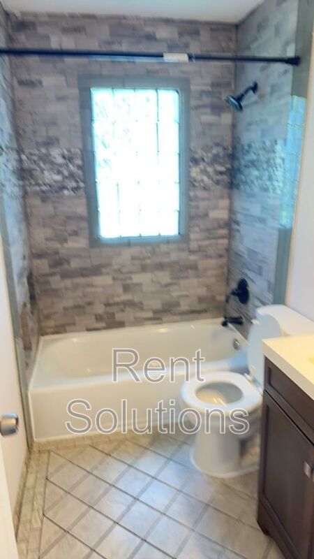 Charming Dunedin Retreat: 2BR Home with Sunroom & Garage! property image