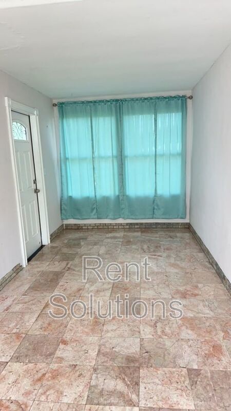 Charming Dunedin Retreat: 2BR Home with Sunroom & Garage! property image