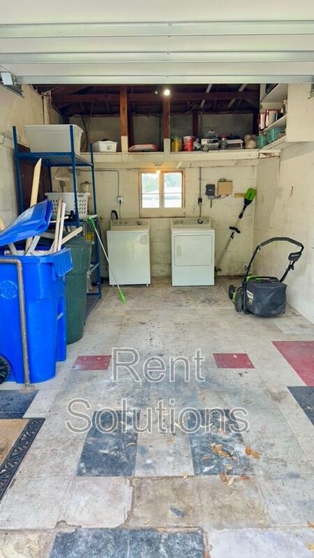 Charming Dunedin Retreat: 2BR Home with Sunroom & Garage! property image