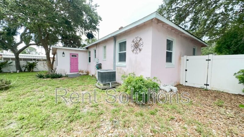 Charming Dunedin Retreat: 2BR Home with Sunroom & Garage! property image